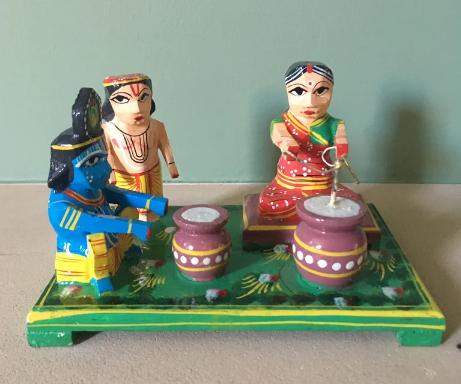 Wooden Yashoda churning butter with Krishna and Balram Idol (Height-8cm) (Width-13cm)